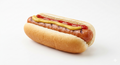 Classic grilled hot dog in bun with mustard and ketchup